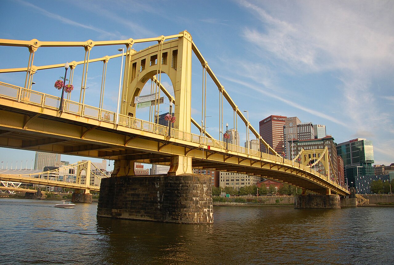 The yellow Roberto Clemente Bridge spanning the Allegheny River in Pittsburgh